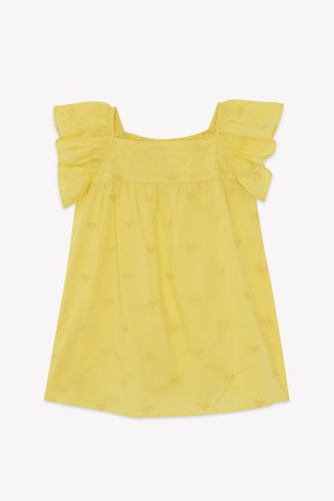Blusa gialla con maniche corte a volant, caratterizzata da motivi a cuore e un design ampio e fluido. Realizzata in tessuto leggero.