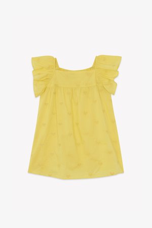 Rumena bluzica s kratkimi, nagubanimi rokavi, ki ima vzorec srca in ohlapen, fluiden dizajn. Narejena iz lahkotnega materiala.