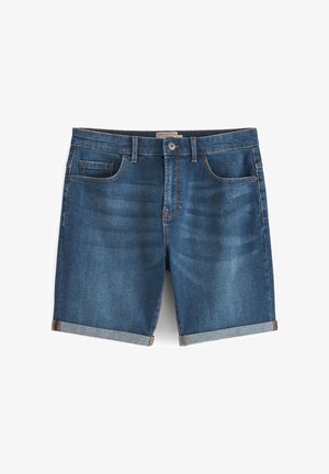 Sötétkék farmer rövidnadrág, hajtott szegéllyel, klasszikus öt zsebes dizájnnal és kontrasztos varrással. Simább textúrájú, minimális mosási hatással.