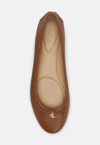 Brown leather ballet flat with textured exterior, rounded toe, decorative bow, and a gold "RLL" accent at the front. Smooth inner lining.