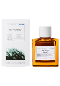 Eau de Toilette de Korres dans un flacon en verre carré avec une teinte ambre. Bouchon blanc et étiquette avec les notes de fragrance imprimées en bleu et noir.