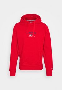 Felpa rossa in cotone con tasca a marsupio, cappuccio con coulisse e logo ricamato "TOMMY JEANS NEW YORK CITY" in blu e bianco sul davanti.