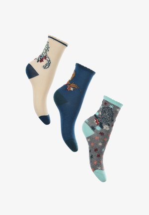 Drei Paare Baumwollsocken: cremefarben mit Tierdesign, marineblau mit bunten Akzenten und grau mit verspielten Mustern und türkisfarbenen Details.
