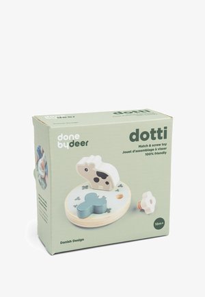 Juguete de madera para niños que incluye fósforos y tornillos, con formas de vaca y flores azules sobre una base redonda, diseñado para niños a partir de 18 meses.