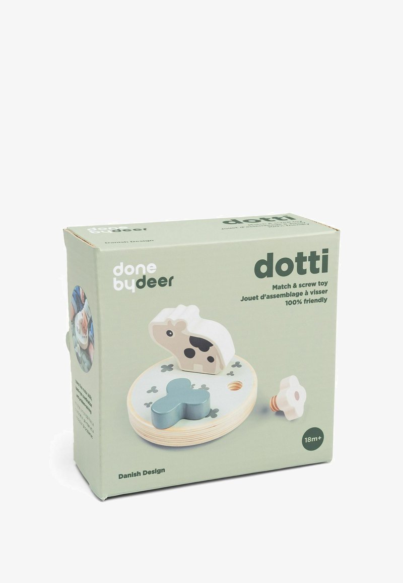 Juguete de madera para niños que incluye fósforos y tornillos, con formas de vaca y flores azules sobre una base redonda, diseñado para niños a partir de 18 meses.