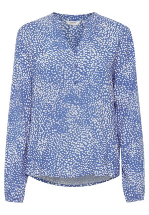 Camisa de manga larga azul con un patrón de lunares en blanco, con escote en V y cierre de botones, hecha de un tejido ligero.