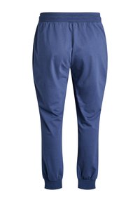 Navy blue sweatpants made of soft fabric with an elastic waistband, tapered legs, and ribbed cuffs at the ankles. No visible pockets.