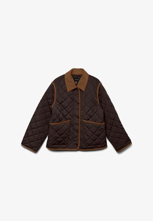 Ruskea tikattu takki, jossa on vaaleanruskea corduroy-kaulus. Ominaisuuksiin kuuluvat kaksi etutaskua, nappikiinnitys ja eroava pipingin reunat.