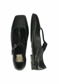 Scarpe in pelle nera con punta quadrata, dotate di una fascia e una fibbia regolabile. Texture liscia con tacco basso e largo.