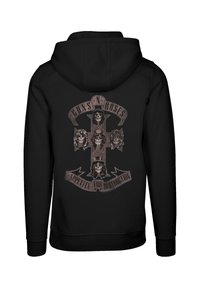 Black hoodie featuring a graphic of a cross with skulls, text reading "GUNS N' ROSES" and "APPETITE FOR DESTRUCTION," bold and detailed design.