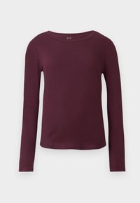 Bordeaux langærmet bluse lavet af ribbet materiale med rund hals og tætsiddende silhuet. Har et mærke med "GAP"-logo på kraven.