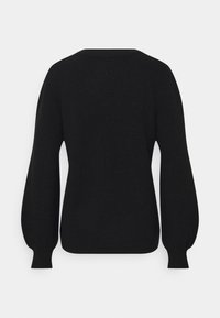 Pull en maille noir à manches longues avec manches bouffantes et poignets côtelés, vu de dos sur un fond clair uni.