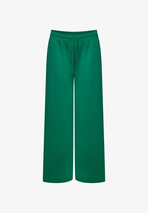 Zielone spodnie szerokie z miękkiego materiału. Posiadają elastyczny pas ze sznurkiem i gładką teksturę.