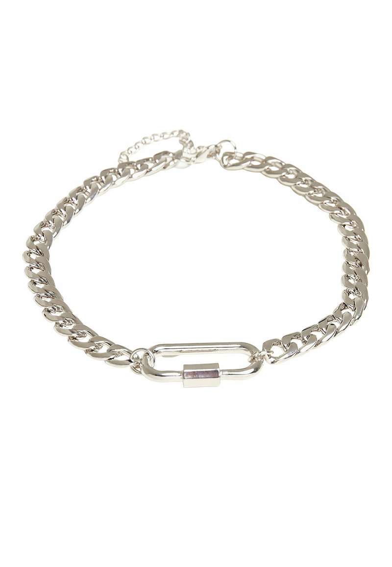 Bracelet en chaîne argentée avec un design à maillons épais, doté d'un fermoir ovale allongé et d'une petite pierre accentuée de couleur violette.