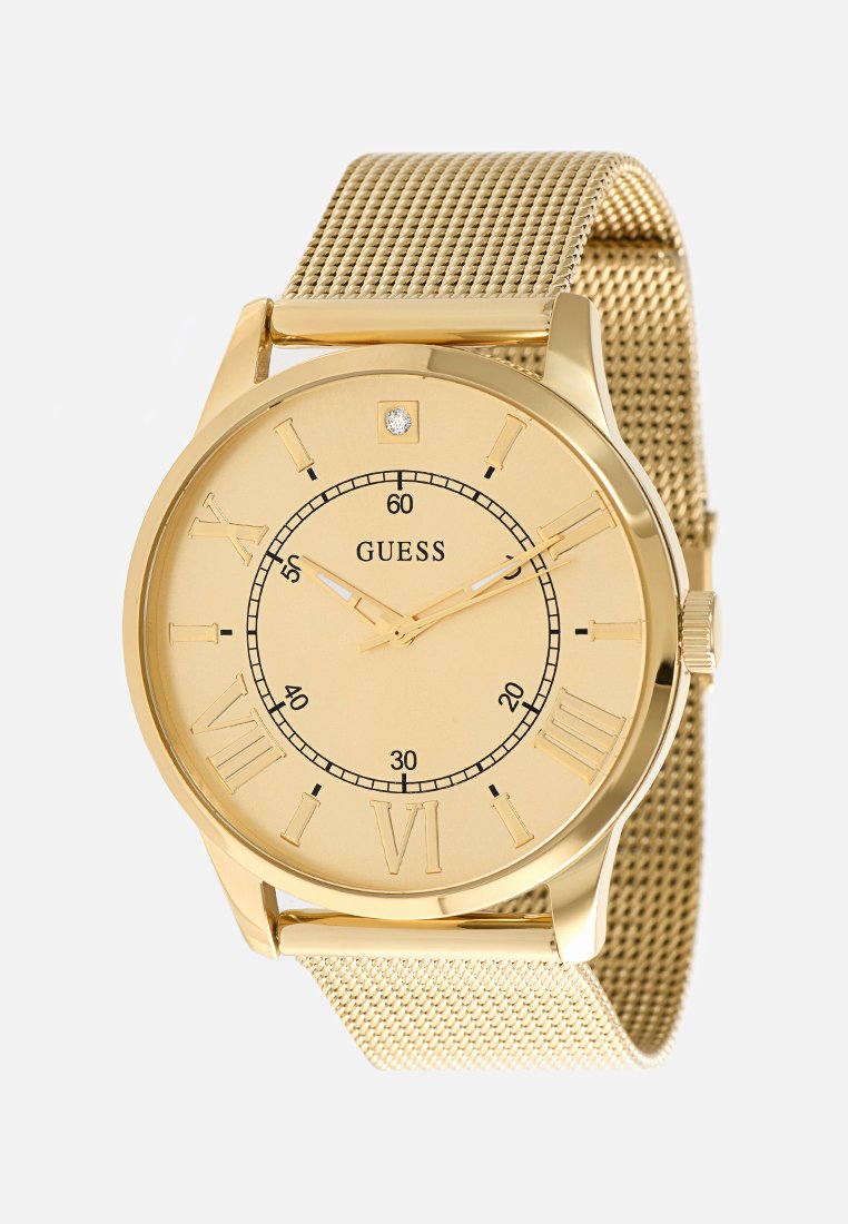 Montre dorée avec un bracelet en maille, des index en chiffres romains et un accent en diamant à 12 heures. Boîtier rond simple avec un cadran lisse.