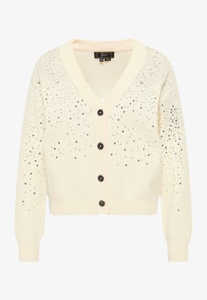 Hele kreemjas kardigan V-kaelusega, kaunistatud hõbedaste sädelustega. Omab musti nuppe ning ribatud varruka- ja allääri. Pehme kudumise tekstuur.