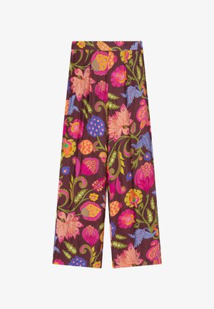 Wijde broek met een levendig bloemmotief in roze, oranje, blauw en groen op een donkerbruine achtergrond.
