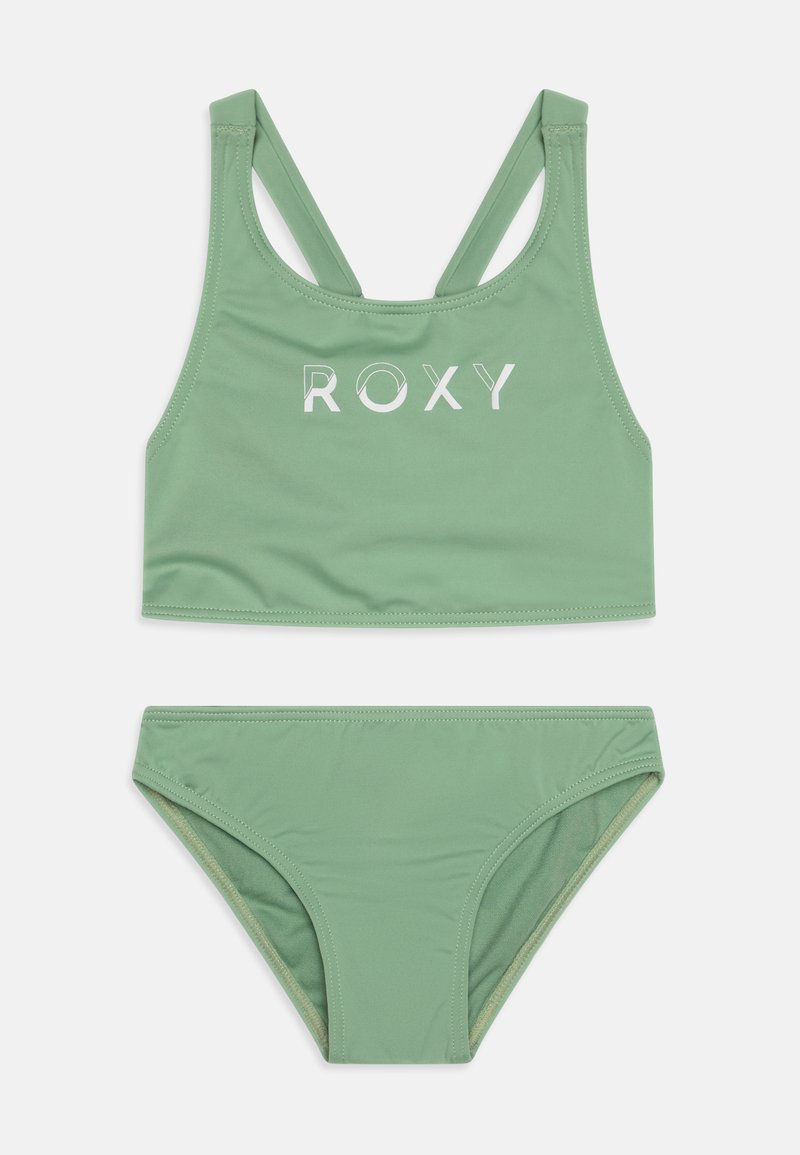 Green two-piece bikini set featuring a racerback top with "ROXY" logo in white. Smooth fabric with a soft texture, ideal for swimwear.