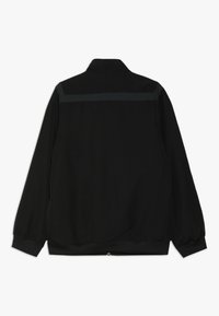 Black jacket with a collared neck, elasticated cuffs, and waistband. Features a textured fabric and a horizontal gray accent on the back.