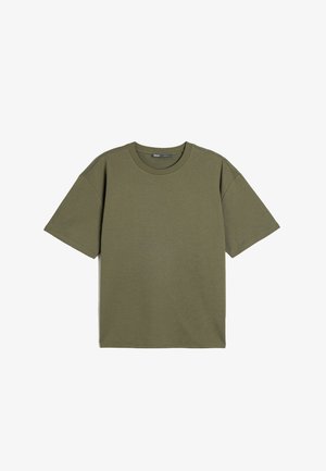 Olivegrøn kortærmet t-shirt. Tøjmateriale i bomuld med rund hals. Løs pasform, ingen mønstre eller detaljer. Enkel, ensfarvet design.