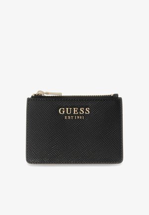 Black textured Guess zippered wallet with gold logo "GUESS EST 1981" on front, rectangular shape, and gold zipper pull.