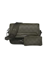 Sac bandoulière vert olive avec motif circulaire en relief, bandoulière ajustable et petite pochette détachable. Texture en cuir lisse et quincaillerie métallique.