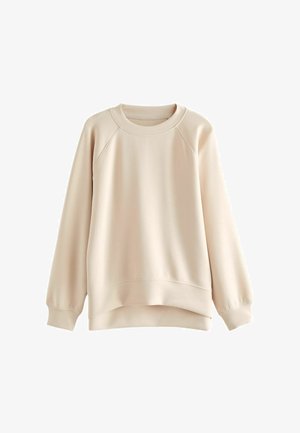 Helle beige Sweatshirt mit Rundhalsausschnitt, Raglanärmeln und leicht abgerundetem Saum. Hergestellt aus glattem Stoff mit gerippten Bündchen.