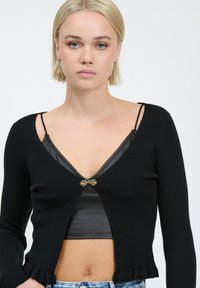 INFLUENCER FRILLED - Gilet - black