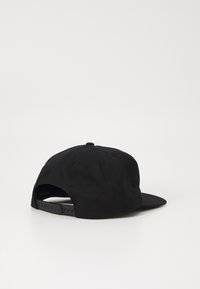 Black cap with a curved brim, smooth texture, and adjustable strap at the back. No visible patterns or graphics.