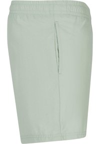 Lyse grønne shorts laget av myk stoff, med elastisk midjebånd, sidelomme og rett snitt design.