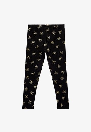 Zwarte legging met een herhalend gouden strikpatroon. Gemaakt van een rekbare stof met een elastische tailleband voor comfort.