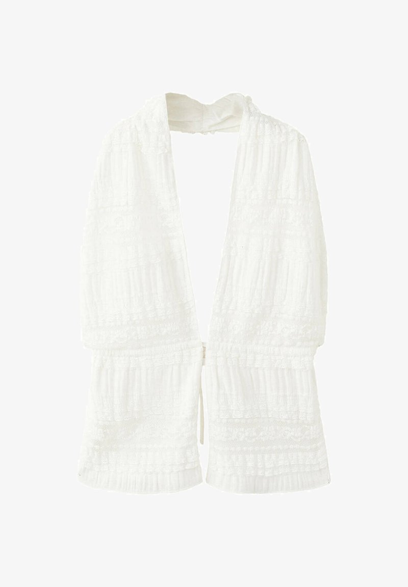Veste blanche texturée à ouverture frontale, manches longues et coupe ample et fluide.