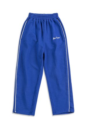 Pantalones de chándal de forro polar azul con franjas laterales blancas, cintura elástica, bolsillos laterales y logotipo de "Bobo Choses" en el muslo izquierdo.