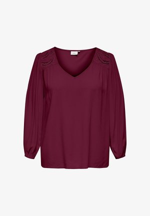 Burgundy blouse with a V-neck and long sleeves. Features intricate lace detailing on shoulders and a smooth, lightweight fabric.