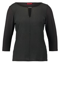 Blouse noire pour femme à manches longues, avec un petit décolleté en forme de trou de serrure à l’avant et un ourlet droit.
