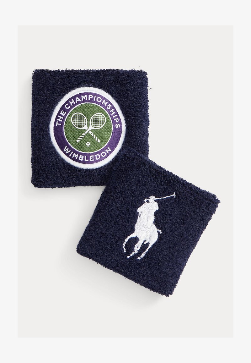 Navy cotton terry wristbands feature embroidered logo with tennis rackets and "The Championships Wimbledon" and a white polo player design.