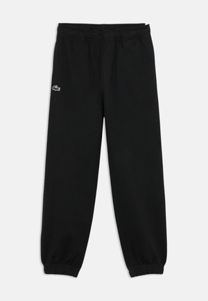 Pantalons de survêtement noirs avec une taille élastique, des chevilles effilées, des poches latérales et un petit logo brodé en blanc avec des accents colorés.