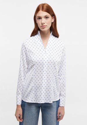 White button-up shirt featuring a subtle blue circular pattern, long sleeves, and a pointed collar with a smooth texture.