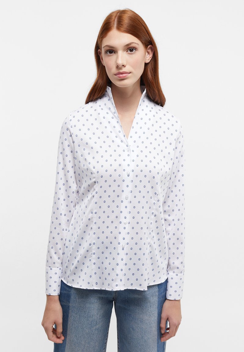 White button-up shirt featuring a subtle blue circular pattern, long sleeves, and a pointed collar with a smooth texture.