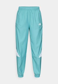 CRAZYLITE PANT - Tracksuit bottoms - powder teal/white