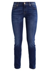 Dark blue denim jeans with a slim fit, featuring five pockets, a button fly, and subtle fading. Classic design with minimal detailing.