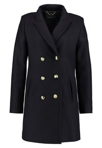 Marinblå dubbelknäppt kappa med skarp krage, guldknappar, sidofickor och en skräddarsydd passform. Tillverkad i en blandning av ull.