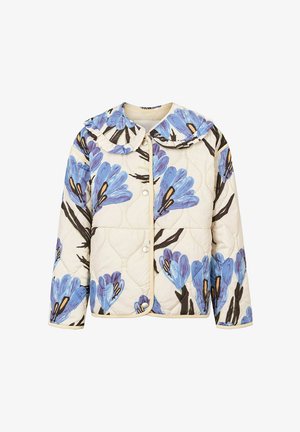 Tikkitakki, jossa on sininen kukkakuvio kermanvärisellä pohjalla, varustettuna röyhelökauluksella ja painonapeilla. Pehmeä kangaspinta.