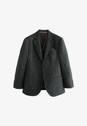 Blazer de tweed gris con solapas de pico, dos bolsillos delanteros y un bolsillo en el pecho. Presenta un cierre de botón y un forro interior suave.