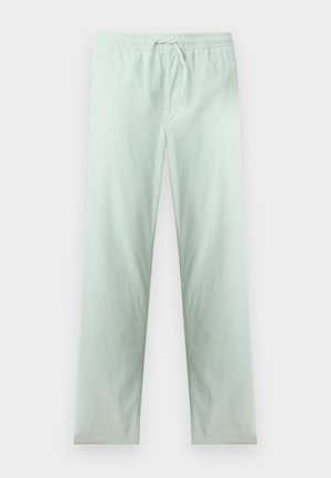 Svetlo zelene hlače z vrvico za zategovanje z elastičnim pasom, ravnimi nogavicami in subtilno navpično rebrasto teksturo.