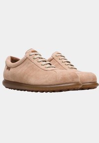 Beige suede shoes with round toe, beige laces, and textured side panels. Soft rubber sole with rounded nubs for grip.