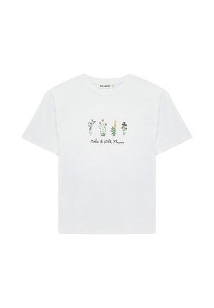 T-shirt blanc à manches courtes avec cinq petites illustrations d’herbes et de fleurs sauvages ainsi que le texte "Herbs & Wild Flowers" sur le devant.