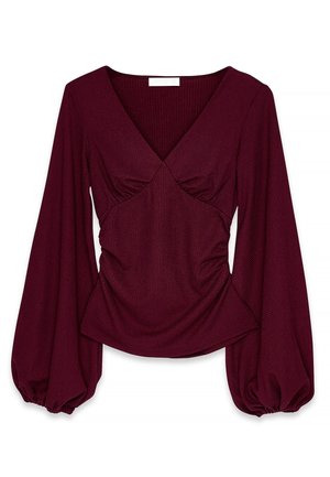 Burgundy long-sleeve top with a V-neck, gathered detailing at the bust, and puffed sleeves with elastic cuffs. Textured fabric.