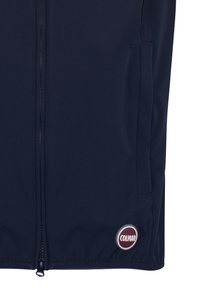 Tengerészkék dzsekirész előzippzárral, oldalzsebekkel és a szegély közelében elhelyezkedő, kerek Colmar logóval.