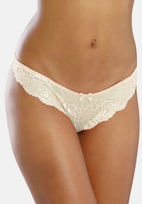 Spitzenunterwäsche in Creme mit floralen Mustern, gewellten Kanten und einem kleinen zentralen Schleifenakzent. Weicher Stoff mit einer engen Passform.